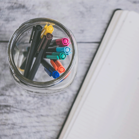 Brushes, pencils and pen on a white background to illustrate how to remove stains from ink, glue, paint etc.